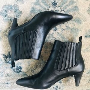 Black leather Chelsea boots with kitten heel.